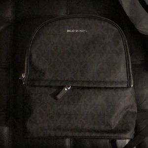 Mk black monogrammed backpack. Measurements 13.75 H , 5. 1/2 D , 13.0 W